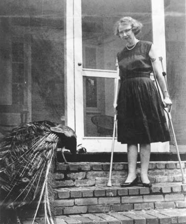 Flannery O'Connor at the steps of her home in Milledgeville, Georgia